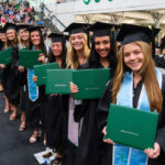 Students holding degrees