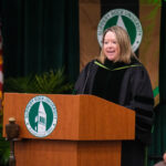 Faculty member giving a speech
