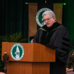 Faculty member giving a speech