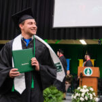 Student smiling after receiving their degree