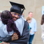 Student hugging a family member