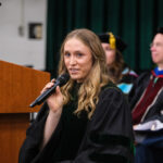 Faculty member giving a speech