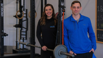 From left, SRU alumnus Karly Allen, '06 DPT, co-owner of Precision Physical Therapy & Performance, is the clinical host for Noah Novak, '22, an SRU doctor of physical therapy student who is completing his clinical internship at Precision in Allison Park.