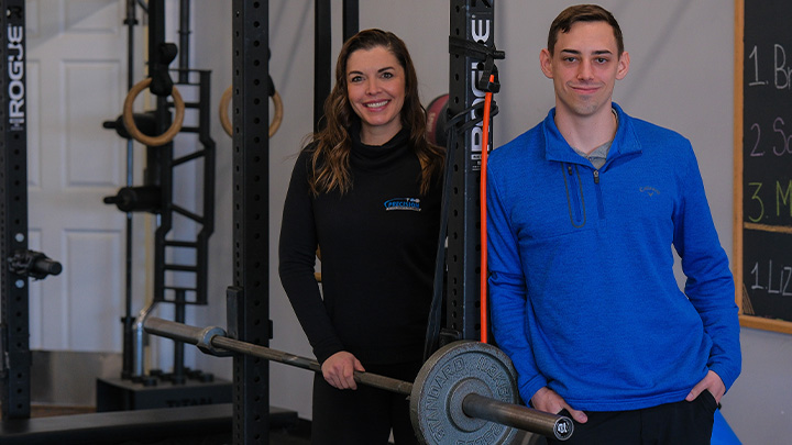 From left, SRU alumnus Karly Allen, '06 DPT, co-owner of Precision Physical Therapy & Performance, is the clinical host for Noah Novak, '22, an SRU doctor of physical therapy student who is completing his clinical internship at Precision in Allison Park.