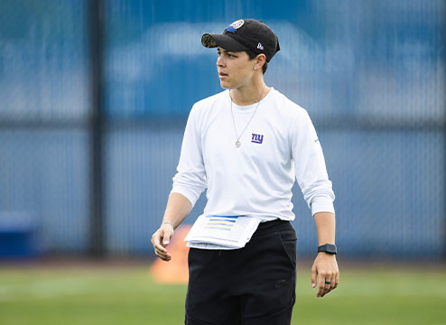 Angela Baker coaches on the field
