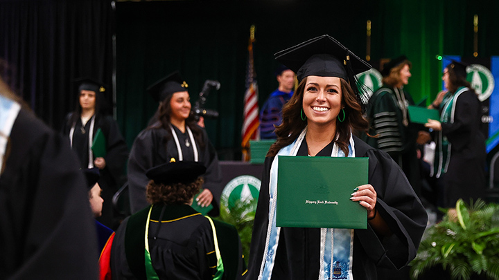 graduate with diploma cover.