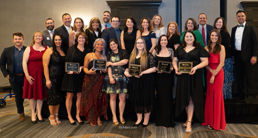 Group of award recipients standing for a posed photo
