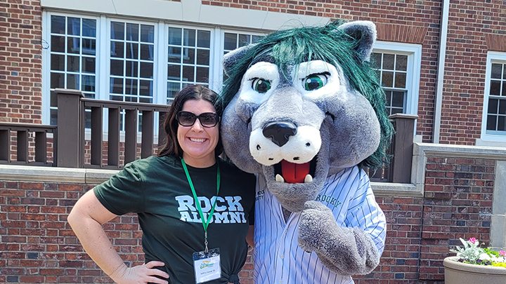 Ashley Ganoe, ’05, one of dozens of alumni who enjoyed the 2024 Alumni Weekend, visits with SRU’s mascot, Rocky.