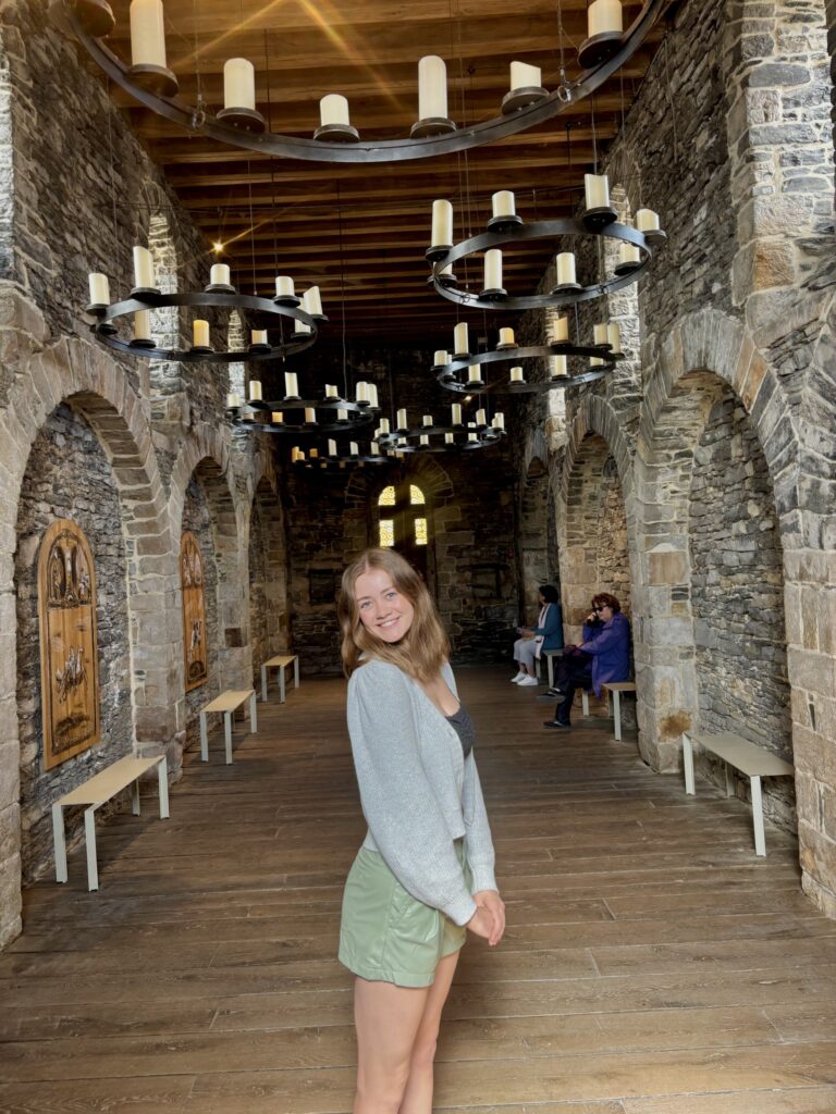 Abby Brubacker posing in a castle.
