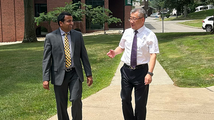 From left, Prasad Vemala, dean of SRU’s College of Business, meets on SRU’s campus with Tony Nie, vice president and dean of the School of International Education at Quanzhou University of Information Engineering.
