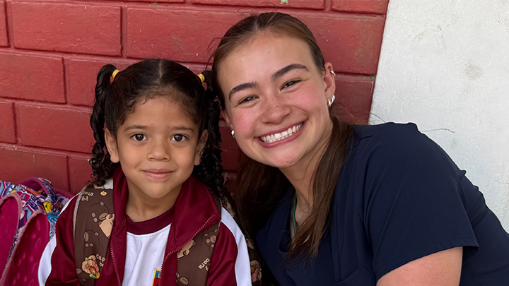 Right, Macie Johnson poses with one of many children assisted by the first day of MEDLIFE mobile clinics at schools in Lima, Peru.