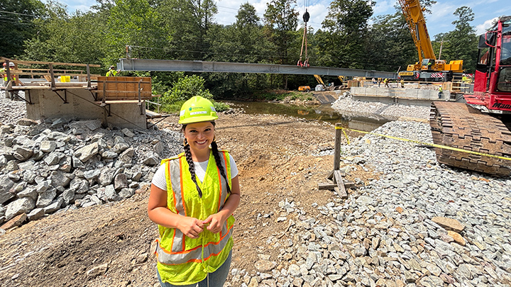 Slippery Rock University civil engineering major Abigail Zeglen wearing a hardhat at a work location during her internship with PennDOT in summer 2025.