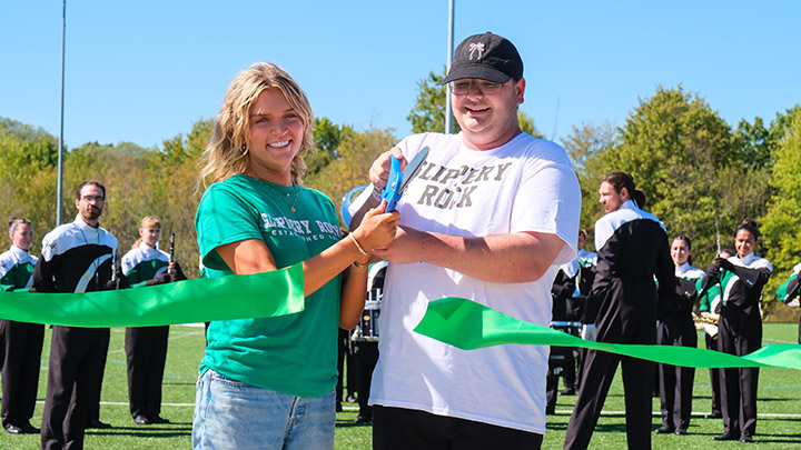 Students cutting a ribbon