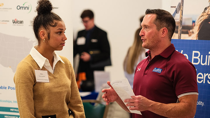 Student talking to a job recruiter