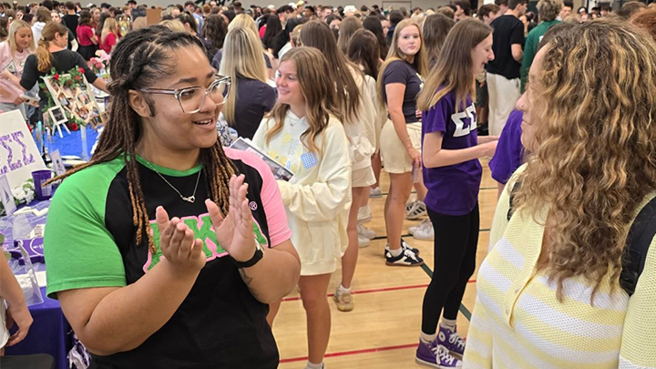 Carrington Williams advocates for leadership opportunities in student organizations like Alpha Kappa Alpha by talking with an SRU student at this year’s Involvement Fair inside the Aebersold Recreation Center. Williams benefited from leadership experiences at SRU including president and treasurer of AKA.