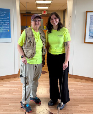 Charlene Subrick and Grace Laudenslager with fishing poles