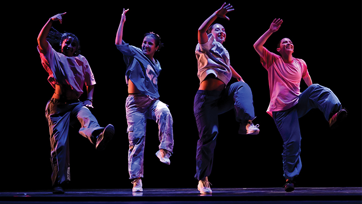 Four dancers on a stage