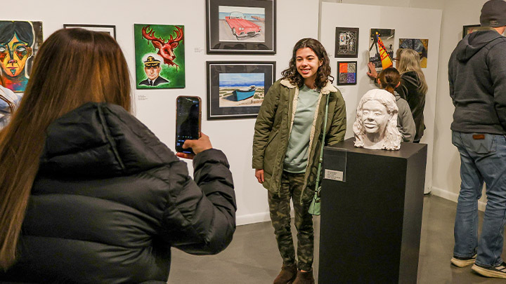 High School student with their art on display