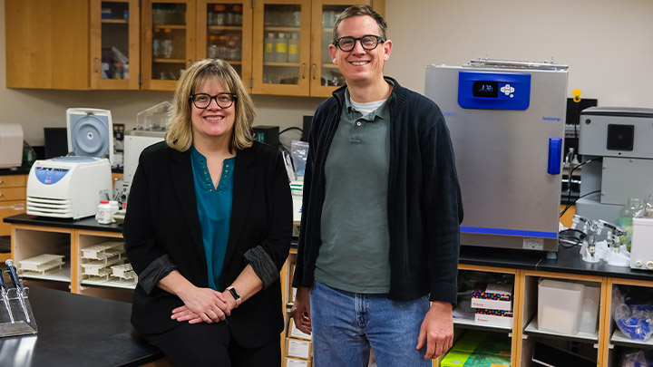 From left, Stacy Hrizo, professor of biology and department chair, and Martin Buckley, associate professor of biology, standing in a lab at SRU.
