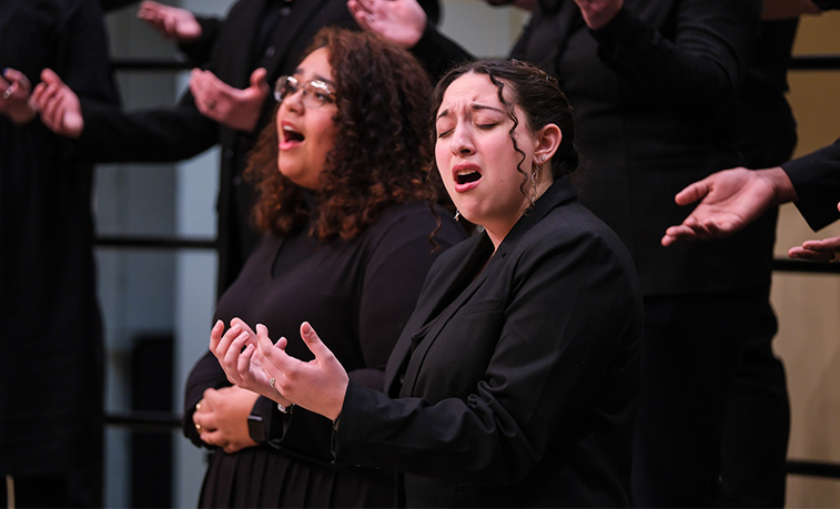 Students sing at a performance