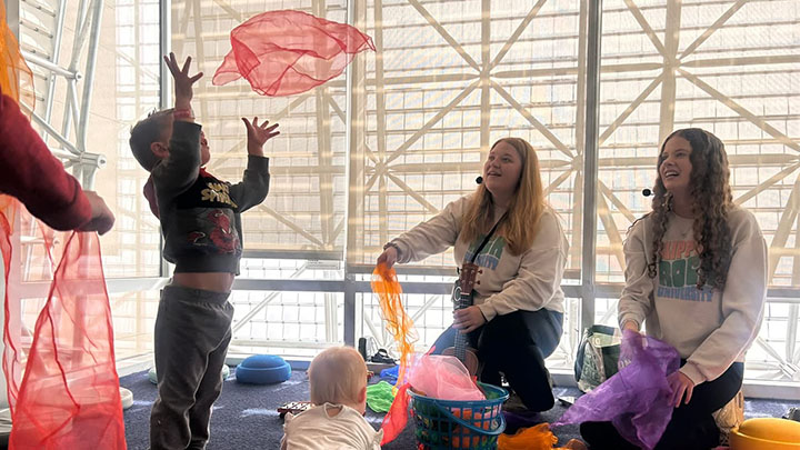 Students working with kids.