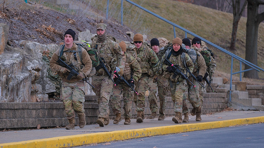 A team of SRU ROTC cadets marching across campus