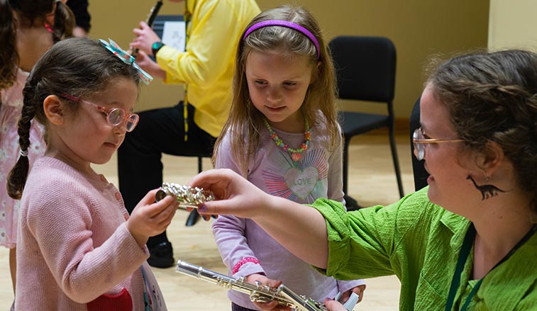 SRU Student helping young children