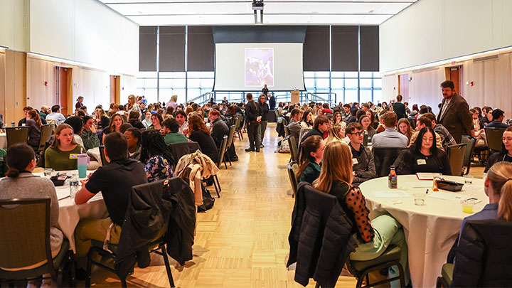 Members of the campus community discussing a medical case