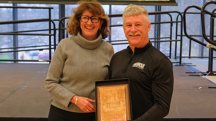 President Riley presents an award.
