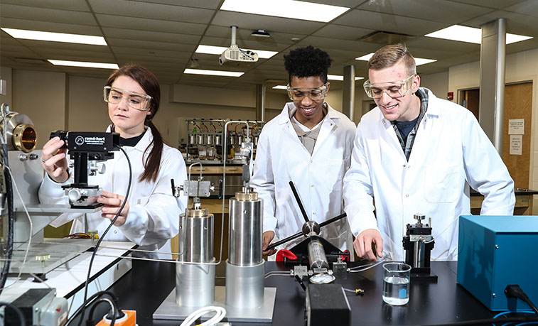Students conduct a science experiment