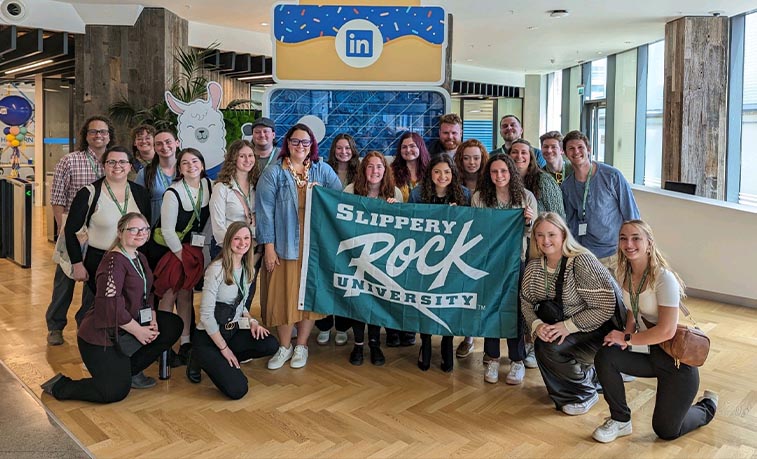 Students holding SRU flag in Ireland