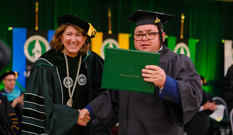 Karen Riley and Alek Richardson at graduation