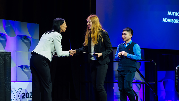 From left, Jeannine Kunz, executive director and CEO of the Society of Manufacturing Engineers, presents award certificates to Slippery Rock University student Jennifer Cichra and professor Jheng-Wun Su for their submission in the Digital Manufacturing Challenge Award at a ceremony conducted, April 8-10, at the SME’s RAPID + TCT event in Detroit.