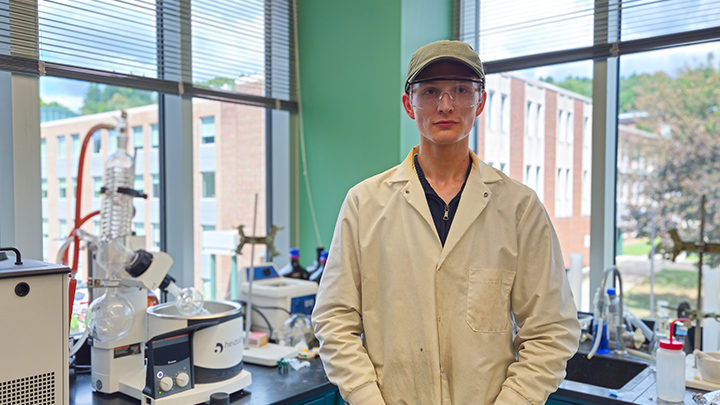 Michael Powell poses in laboratory attire in an SRU chemistry laboratory .