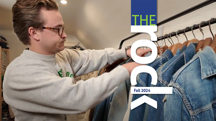 Aaron Fry looks through vintage clothes