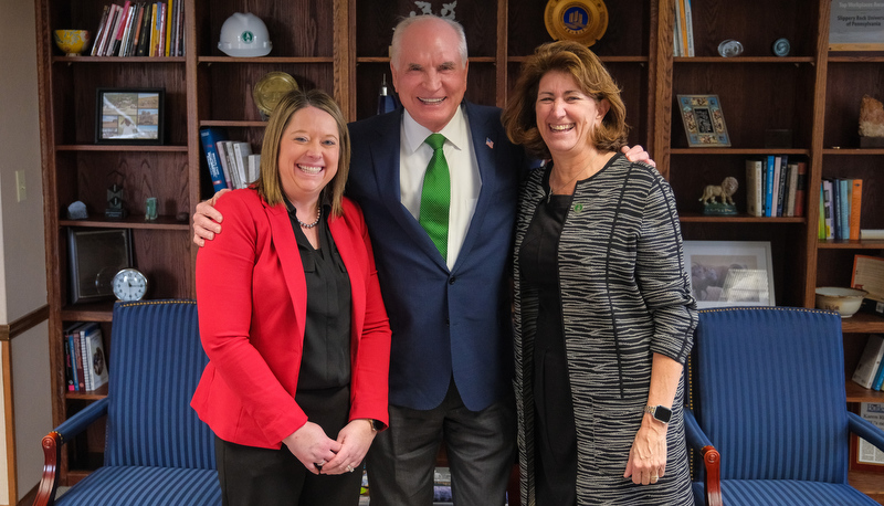 Mike Kelly poses with SRU staff