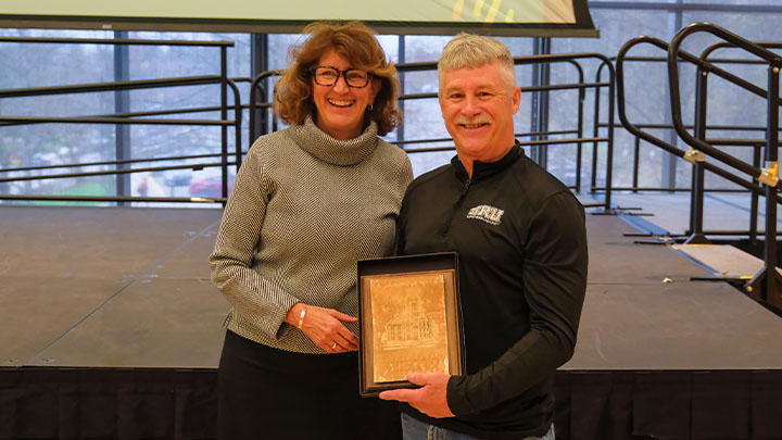 President Riley Presents an award.