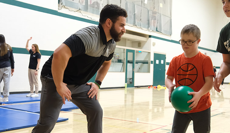 SRU student teaching and playing with child