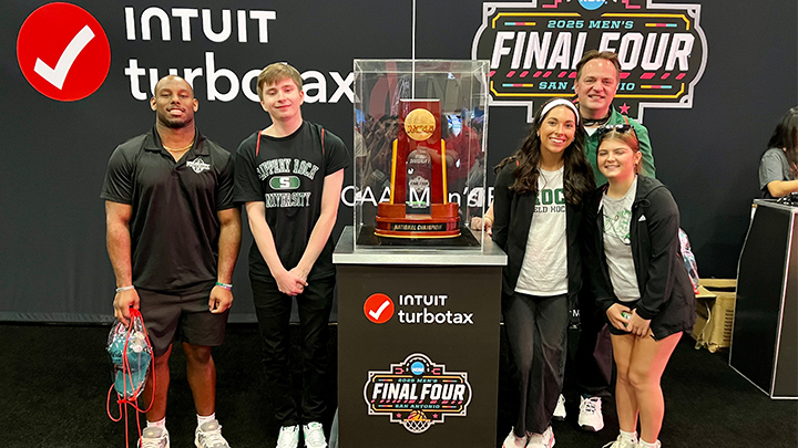 Students with Final Four trophy