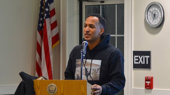 Man speaking at a podium