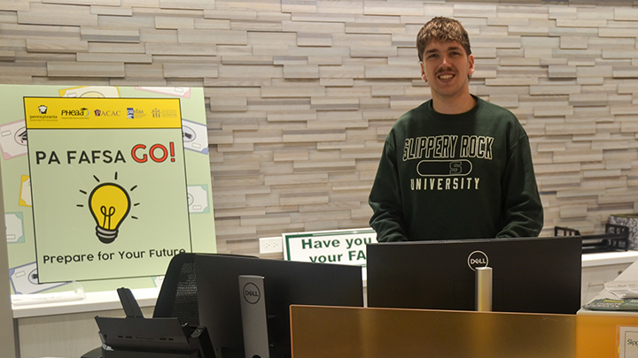 Student at desk with PA FAFSO Go sign