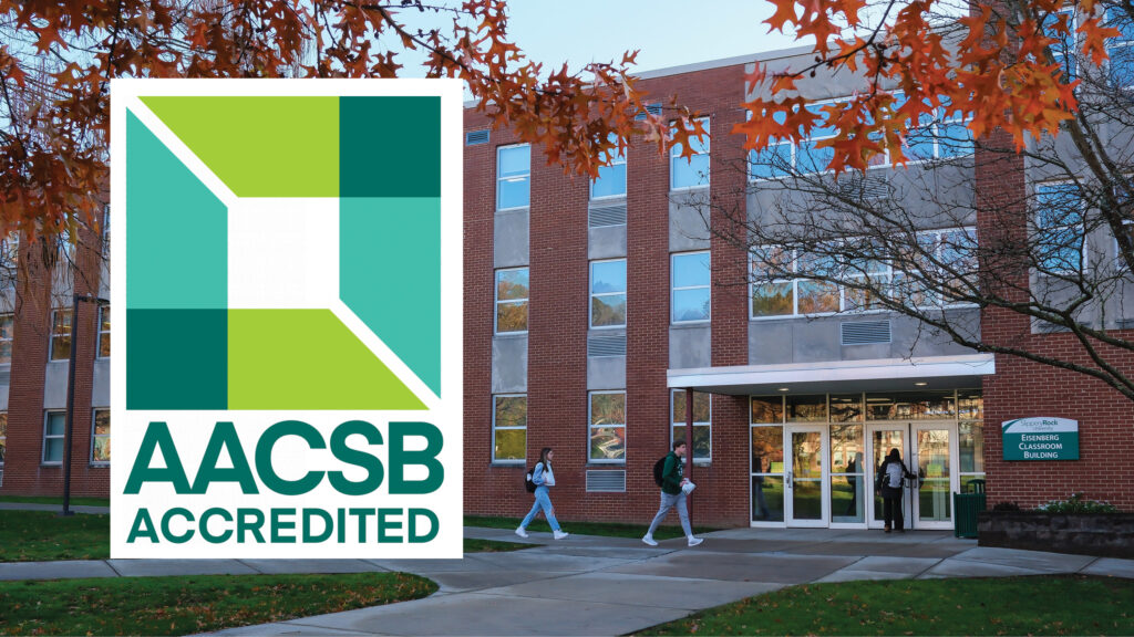 AACSB logo with classroom building and students walking outside.