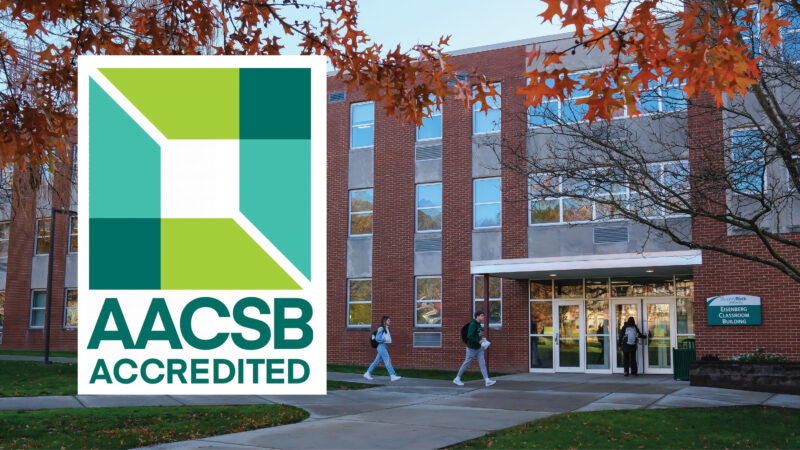 AACSB logo with classroom building and students walking outside.
