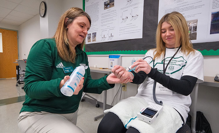 Students learn how to operate health care equipment