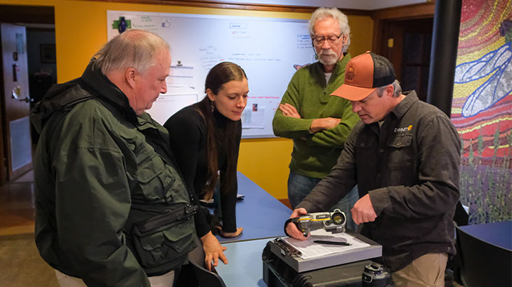 Joel Morrison, Brian Henderson, Sami Bortz, and Paul Scanlon look at a camera.