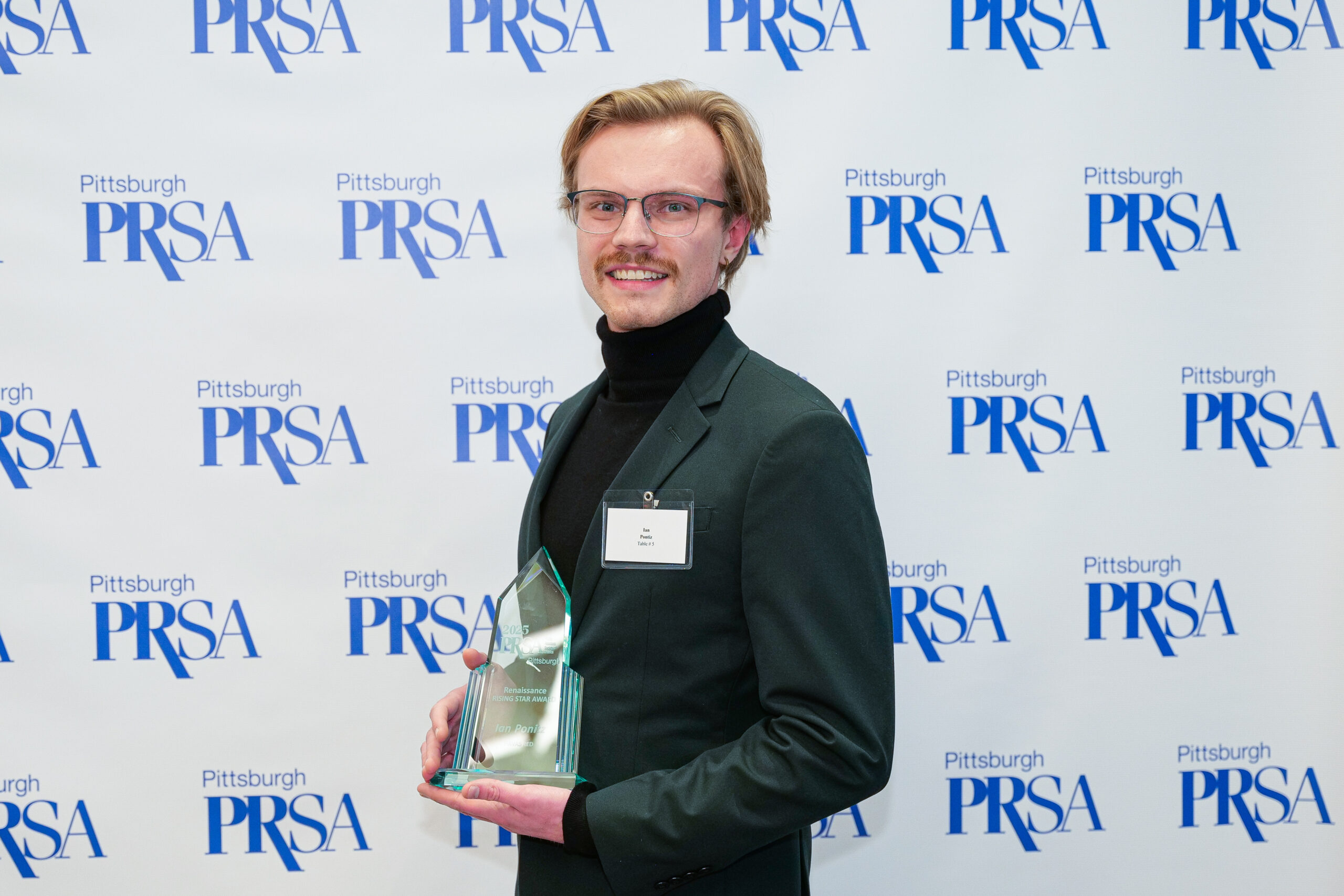 Ian Ponitz displaying his Rising Star Award trophy