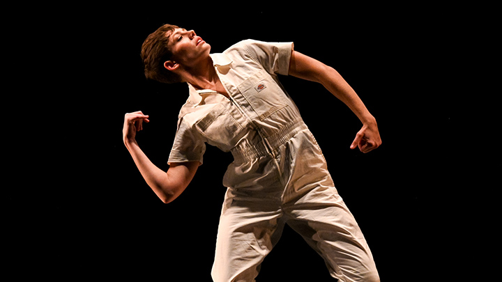 Woman dancing in astronaut suit.