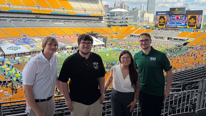 From left, SRU students William Trubic, Landon Pagley, Noelle Paratore and Garrett Dollin were credentialed media covering the NFL Draft for The Rocket and WSRU-FM, student-run media at SRU.