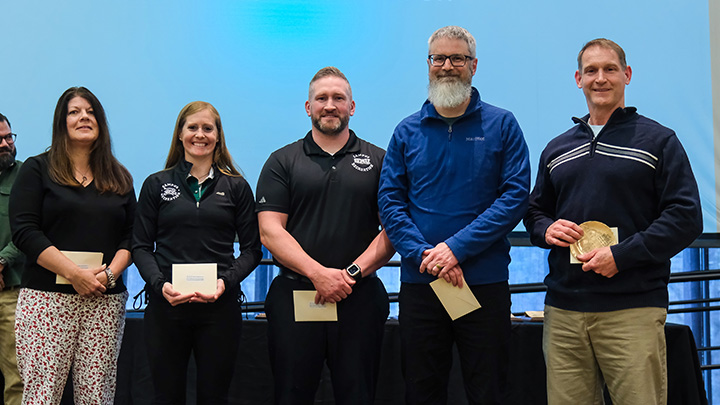 Member of the Campus Recreation staff (from left, Karin Brown, Vanessa Johnson, Ryan Stack, Andrew Loue and Brian Mortimer) are presented the Teamwork/Collaboration Award.