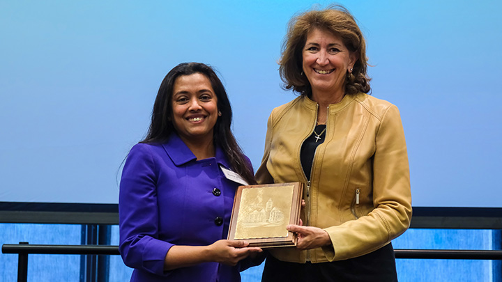 From left, Sunita Mondal, professor of business, is presented the 2026 President’s Award for Faculty Outstanding Service Award by SRU President Karen Riley.